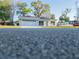 Exterior view of this house with a large two-car garage and inviting front entrance at 765 W Lansdowne Ave, Orange City, FL 32763