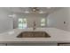 Close-up of a kitchen island with a stainless steel sink and modern fixture, perfect for entertaining at 765 W Lansdowne Ave, Orange City, FL 32763