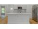 Stylish kitchen island with seating, providing a perfect spot for casual dining and meal preparation at 765 W Lansdowne Ave, Orange City, FL 32763