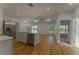 Open concept living area showcasing hardwood floors, recessed lighting, and modern light fixtures at 765 W Lansdowne Ave, Orange City, FL 32763