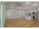Spacious living room with a fan and modern lighting that flows seamlessly into the kitchen at 765 W Lansdowne Ave, Orange City, FL 32763