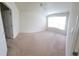 A spacious bedroom featuring carpet and a large window for natural light at 8343 Bella Tierra Ct # 8343, Davenport, FL 33896