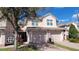 Charming townhome featuring a private garage and a meticulously maintained landscaped yard, offering curb appeal and convenience at 8343 Bella Tierra Ct # 8343, Davenport, FL 33896