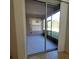 Enclosed lanai with serene outdoor views and offering a relaxing space for lounging and enjoying nature at 8343 Bella Tierra Ct # 8343, Davenport, FL 33896
