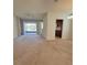 Bright and airy living area with a sliding glass door to the screened-in patio at 8343 Bella Tierra Ct # 8343, Davenport, FL 33896