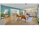 Mid century modern living room; teal walls, terrazzo floors at 10 Madera Rd, Debary, FL 32713