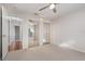 Well-lit bedroom with mirrored closet doors and carpet at 1591 Rockwell Heights Dr, Deland, FL 32724