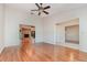 Bright living room with hardwood floors, fireplace, and views to backyard at 1591 Rockwell Heights Dr, Deland, FL 32724