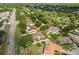 Aerial view of the property showcases the home's location in a lush, residential neighborhood at 1608 Bomi Cir, Winter Park, FL 32792