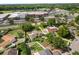 The aerial view displays the home's proximity to schools and the neighborhood at 1608 Bomi Cir, Winter Park, FL 32792