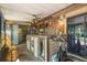 Enclosed outdoor bar with ceiling fan, sliding glass door, and a workout bike at 1608 Bomi Cir, Winter Park, FL 32792
