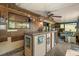 Enclosed outdoor bar with ceiling fan, window, TV, and seating area at 1608 Bomi Cir, Winter Park, FL 32792