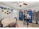 Bedroom features neutral walls, wood flooring, a ceiling fan, and decor at 1608 Bomi Cir, Winter Park, FL 32792