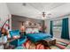 Comfortable bedroom featuring a bed with unique decor and ample lighting at 1608 Bomi Cir, Winter Park, FL 32792