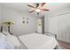 Neutral bedroom with a ceiling fan, plush rug, and a double door closet at 1608 Bomi Cir, Winter Park, FL 32792