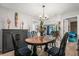 Stylish dining room featuring an oval table with black chairs and modern decor at 1608 Bomi Cir, Winter Park, FL 32792