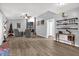 Spacious living room with a fireplace, hardwood floors, a ceiling fan and neutral tones at 1608 Bomi Cir, Winter Park, FL 32792
