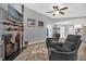 Bright living room features a fireplace, wooden floors and neutral decor at 1608 Bomi Cir, Winter Park, FL 32792
