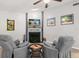 Living room featuring a fireplace, ceiling fan, and modern floors at 1608 Bomi Cir, Winter Park, FL 32792