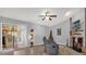 Living Room features a fireplace, sliding glass doors and hard wood flooring at 1608 Bomi Cir, Winter Park, FL 32792