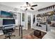Home office featuring a computer setup, built-in shelves, and a cozy reading nook at 1608 Bomi Cir, Winter Park, FL 32792