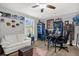 Functional office space with a white couch, desk setup, and ample storage at 1608 Bomi Cir, Winter Park, FL 32792