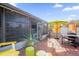 Enclosed patio with outdoor furniture, plants, and a grill for relaxing or entertaining at 1608 Bomi Cir, Winter Park, FL 32792