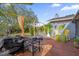 Outdoor patio with a grill, seating, and landscaping perfect for entertaining at 1608 Bomi Cir, Winter Park, FL 32792