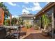 Outdoor patio with grill, seating, and outdoor decor and plants at 1608 Bomi Cir, Winter Park, FL 32792
