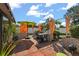 Inviting outdoor patio with a grill, patio umbrella, and vibrant accents, perfect for outdoor dining at 1608 Bomi Cir, Winter Park, FL 32792