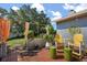Cozy outdoor patio featuring colorful decor, seating, and a barbecue grill for entertaining guests at 1608 Bomi Cir, Winter Park, FL 32792