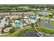 Aerial view of community waterpark with pool and slides at 220 Macaulays Cv, Haines City, FL 33844