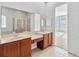 Elegant bathroom with double sinks, soaking tub, and walk-in shower at 2620 Sand Arbor Cir, Orlando, FL 32824
