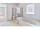 Spa-like bathroom featuring a large soaking tub and shower at 2620 Sand Arbor Cir, Orlando, FL 32824