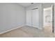 Well-lit bedroom with double-door closet and access to the upper hallway at 2620 Sand Arbor Cir, Orlando, FL 32824