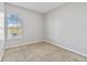 Bright bedroom with a large window, neutral walls, and carpeted floor at 2620 Sand Arbor Cir, Orlando, FL 32824