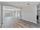 Bright dining room with hardwood floors and an open floor plan at 2620 Sand Arbor Cir, Orlando, FL 32824