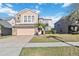 Two-story house with stone accents and a two-car garage at 2620 Sand Arbor Cir, Orlando, FL 32824