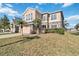 Two-story house with stone accents and a two-car garage at 2620 Sand Arbor Cir, Orlando, FL 32824