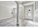 Bright foyer with an arched entryway and hardwood floors at 2620 Sand Arbor Cir, Orlando, FL 32824