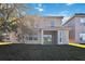 Two-story house with backyard and patio at 2620 Sand Arbor Cir, Orlando, FL 32824