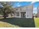 Two-story house with backyard and patio at 2620 Sand Arbor Cir, Orlando, FL 32824