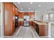 Kitchen with stainless steel appliances and wood cabinets at 2620 Sand Arbor Cir, Orlando, FL 32824