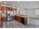Kitchen with stainless steel appliances and wood cabinets at 2620 Sand Arbor Cir, Orlando, FL 32824