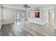 Open concept living room and kitchen with vinyl flooring and lake view at 2620 Sand Arbor Cir, Orlando, FL 32824