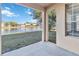 Covered patio overlooking a tranquil lake at 2620 Sand Arbor Cir, Orlando, FL 32824