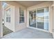 Spacious patio with sliding glass doors leading to the backyard at 2620 Sand Arbor Cir, Orlando, FL 32824