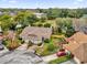 Aerial view of a residential area showing a tan house with brown roof at 2682 Orange Peel Ct, Orlando, FL 32806