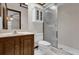 Clean bathroom with shower, toilet, and vanity with wood cabinets at 2682 Orange Peel Ct, Orlando, FL 32806