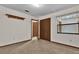 Spacious bedroom with wood closets, wall shelf, and access to a hallway at 2682 Orange Peel Ct, Orlando, FL 32806